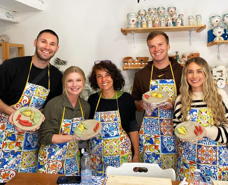 People participating in hands-on workshops with skilled local artisans in the Amalfi Coast.
